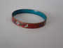 Vintage Chinese cloisonné enamel bangle with floral decoration on a russet-red ground and turquoise-blue enamel interior.