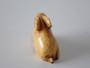 19th-century Japanese ivory rabbit netsuke with folded ears, rich honey patina and historical handling wear.