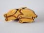 19th-century Japanese ivory rabbit netsuke with folded ears, rich honey patina and historical handling wear.