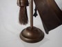 Victorian brass fireplace companion set with poker, tongs, shovel and brush on decorative stand circa 1880–1910.