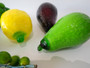 Vintage Murano style art glass fruit collection with colourful glass grapes, lemon, pear, avocado and green fruiting branch.