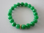 Vintage Chinese green jade  bead stretch bracelet with natural internal clouding and 9ct gold gem-set spacer.