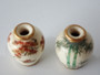 Pair of antique Japanese Shinzan Kamiyama miniature Satsuma vases with maple and bamboo decoration and gilt rims.