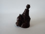 Antique Japanese carved dark wood netsuke depicting a rat climbing a hand broom, signed on an inset ivory plaque.