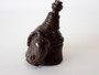 Antique Japanese carved dark wood netsuke depicting a rat climbing a hand broom, signed on an inset ivory plaque.