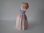 Doulton Miss Demure 1930s bone china lady figurine in a pink gown with green bonnet and parasol, measuring 20cm tall.