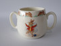 Vintage Royal Doulton Bunnykins two-handled ceramic mug featuring rabbits knitting with colourful wool and hopping rabbits around the rim.