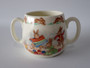 Vintage Royal Doulton Bunnykins two-handled ceramic mug featuring rabbits knitting with colourful wool and hopping rabbits around the rim.