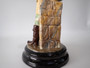 Antique Continental majolica Winter Boy ceramic figurine circa 1890–1910, wearing a blue coat and scarf and holding snowballs beside a stone wall.