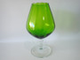Vintage Italian Empoli lime-green hand-blown glass brandy balloon vase, circa 1960–1970, with clear pedestal stem and scalloped rim, measuring 32cm tall.