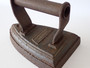 Antique George Salter & Co Sylvester Patent cast-iron sad iron with fixed metal handle, surface rust and age-related pitting.