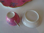 Mid 19th century child’s tea set with pink floral decoration including tray teapot creamer and cup