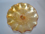 Antique Fenton apricot carnival glass Little Flowers bowl with embossed floral decoration, golden iridescence and finely crimped rim.