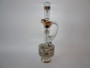 Tall vintage Czech Bohemian clear glass decanter with frosted gilt-decorated body, curved handle and elongated glass stopper.