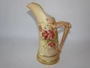 Antique Royal Worcester blush ivory porcelain ewer dated 1911 with hand-painted floral decoration and distinctive stag horn-style handle, 17cm tall.