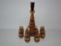 Vintage 1960s Bohemian amber glass decanter with gold stripe decoration and six matching glasses.