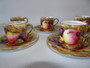 6 Aynsley fruit and berry design coffee cups and saucers, handpaintd and transfer printed; saucer by D Jones, cups by N. Brunt dated 1939.