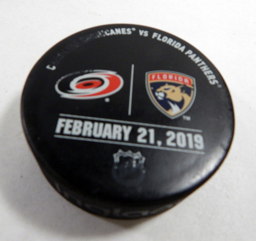 Florida Panthers Vs. Carolina Hurricanes Game Used Black Warm Up Puck DP61369