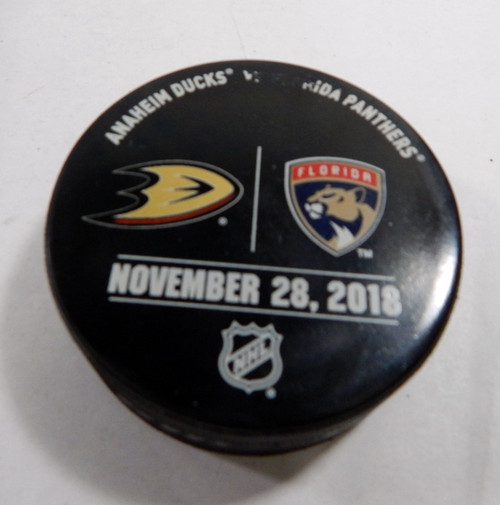 Florida Panthers Vs. Anaheim Ducks # Game Used Black Warm Up Puck DP61339