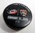 Florida Panthers Vs. Carolina Hurricanes Game Used Black Warm Up Puck DP61369