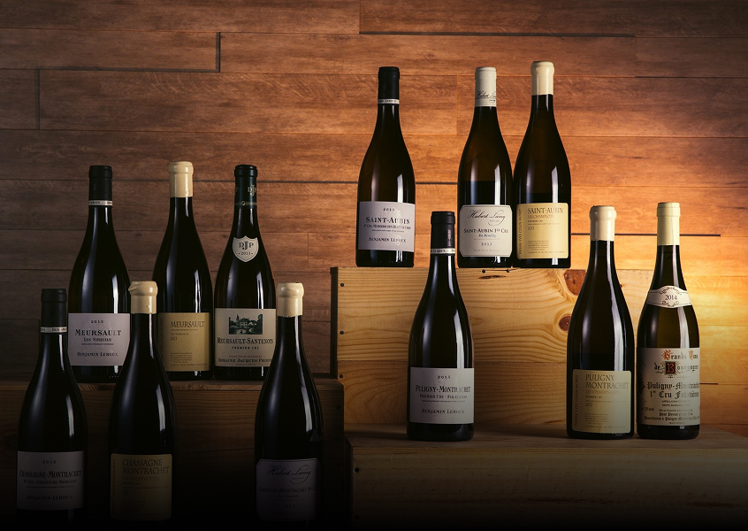 A collection of wine bottles at different heights