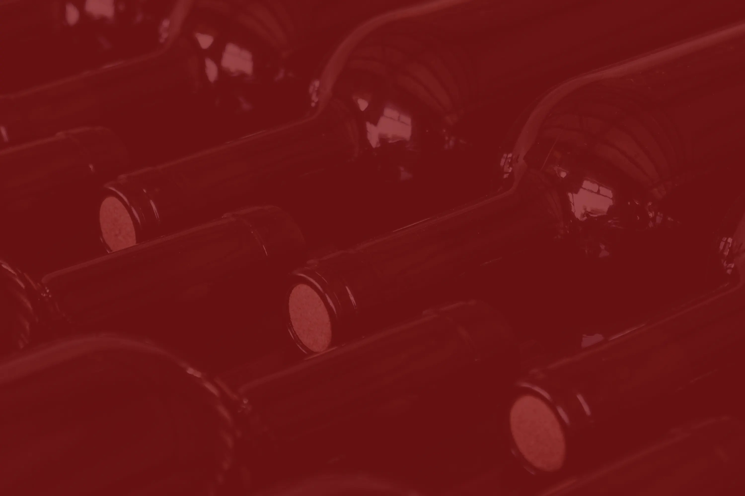 a close up of wine bottles stacked together
