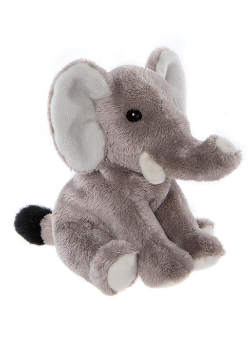 A grey elephant plush toy sits upright against a white background, featuring large ears, a raised trunk, small tusks, and a black-tipped tail.