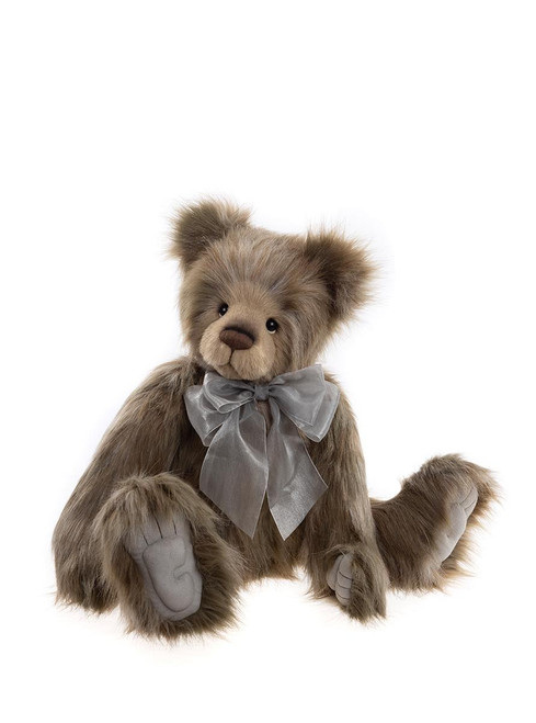 A brown, fluffy Charlie Bears teddy bear sits upright against a white background, wearing a silver satin bow tie, with detailed paw pads and a lighter-colored muzzle.