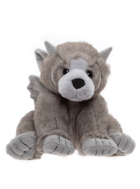 A grey plush wolf teddy bear sits upright against a white background, featuring pointed ears, small wings on its back, and lighter grey paw pads.