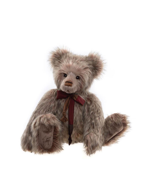 A fluffy brown Charlie Bear teddy bear sits upright against a white background, wearing a burgundy and bronze ribbon bow tied at its neck.