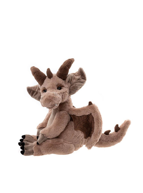 A brown dragon plush toy with horns, wings, claws, and a tail rests in a lounging position against a white background.