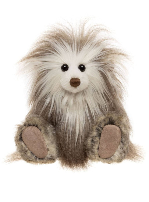 A fluffy, shaggy teddy bear with wild white and grey-brown fur, black bead eyes, and a brown velvet nose sits upright against a white background.