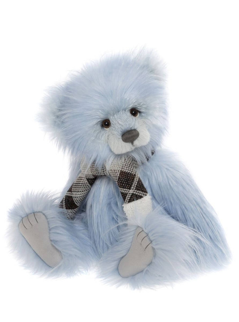 A fluffy light blue Charlie Bears teddy bear sits upright, wearing a black and white plaid scarf, with grey paw pads and a white muzzle, against a white background.