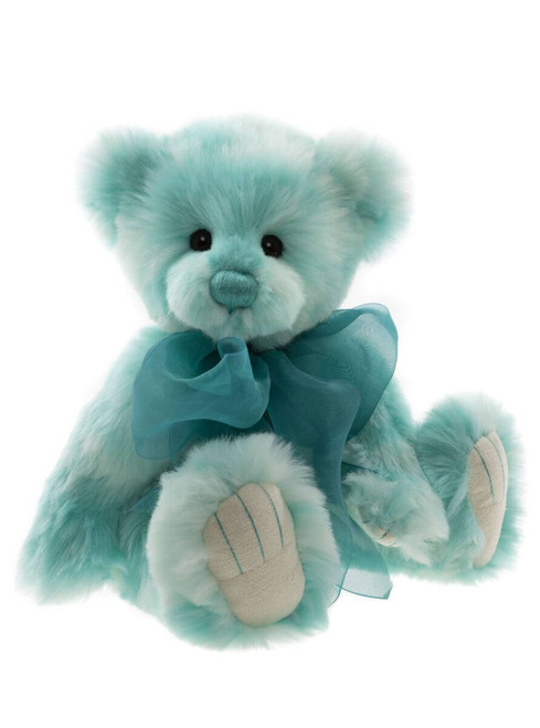 A teal and white fluffy teddy bear sits upright against a white background, wearing a sheer teal organza bow tied around its neck.
