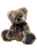A fluffy brown teddy bear sits upright against a white background, wearing a navy blue satin ribbon bow tied around its neck, with matching dark blue paw pads.