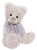 A pale pink plush teddy bear sits upright against a white background, wearing a light blue organza and satin ribbon bow tied around its neck.