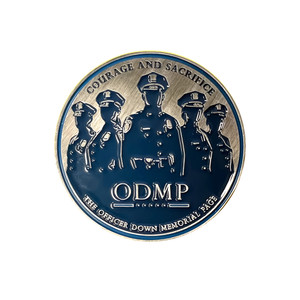 Officer Down Memorial Page Annual 2025 challenge coin featuring the silhouette of police officers. Officer Down Memorial Page Annual 2025 challenge coin featuring the silhouette of police officers.