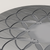 Close detail of the etched Flower of Life pattern