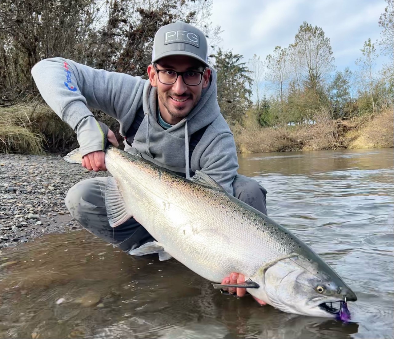 Person holding a Chinook with a bobber down jig