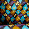 Princess Jasmine-inspired Loungefly mini backpack featuring shimmering turquoise fabric, floral appliqués and gold accents.