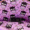 Black Loungefly Sanrio Badtz-Maru mini backpack featuring Badtz-Maru holding a pastel purple jack-o'-lantern surrounded by colorful Halloween candy.