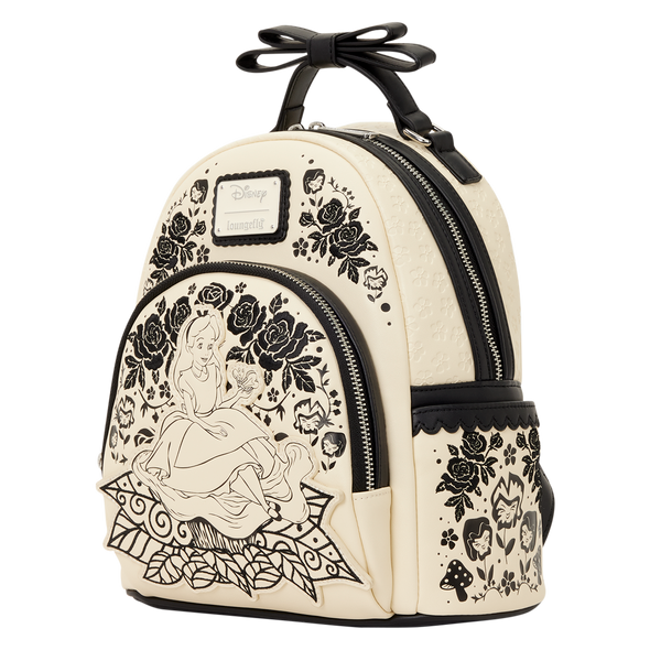 Alice in Wonderland embroidered Disney mini backpack featuring floral artwork and elegant cream and black color palette