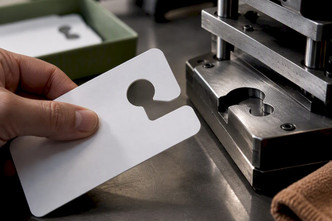 Match Mirror Geometry: Hang Tag Hole Shapes for Parking Operators