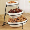 Three porcelain bowls in graduated sizes provide ample space for a variety of treats, dips, or condiments. 