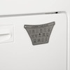 Magnetic back attaches to washer or dryer 