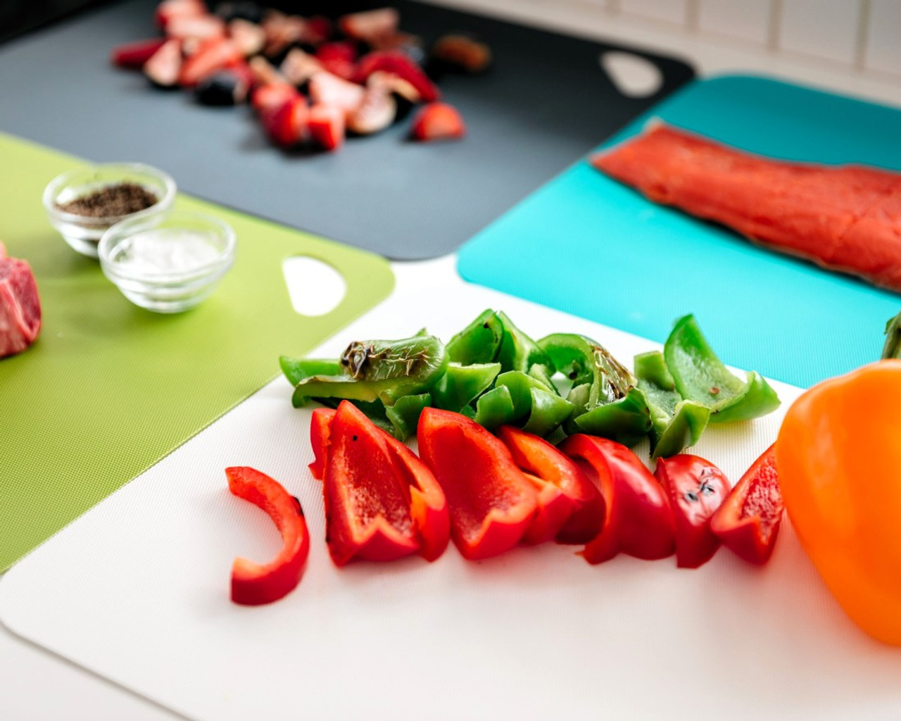 Each cutting board is a different color and ideal for keeping foods separate.