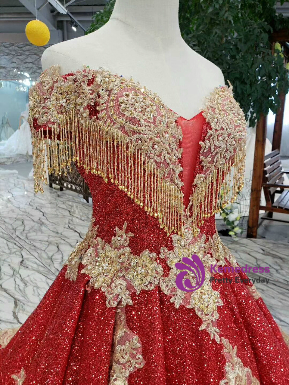 Red sequin ball gown wedding dress with appliqué detailing and full skirt