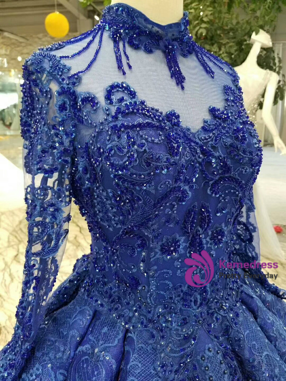 Royal blue luxury ball gown with high neckline and long sleeves