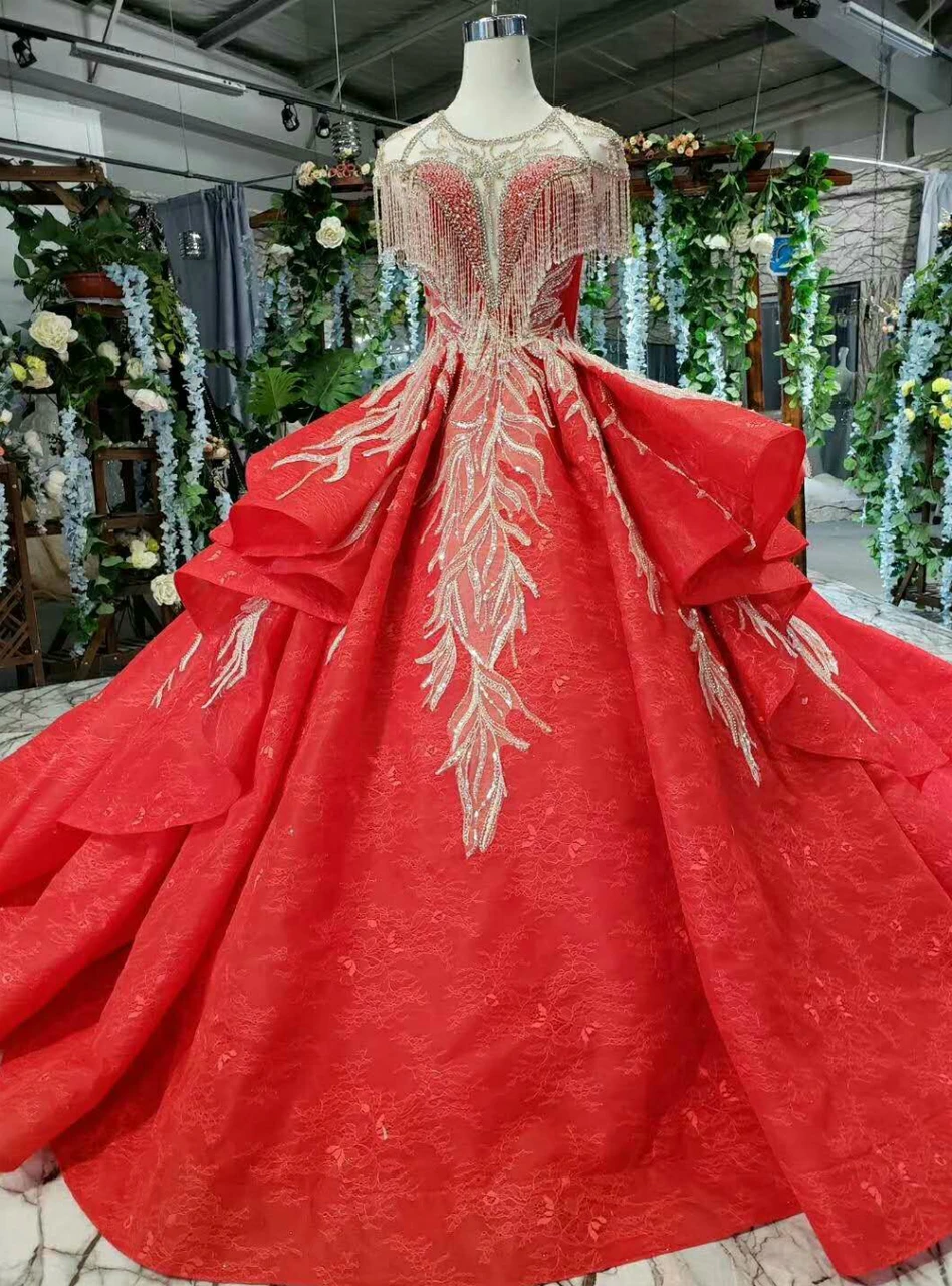 Red floral lace ball gown wedding dress with cap sleeves and full skirt