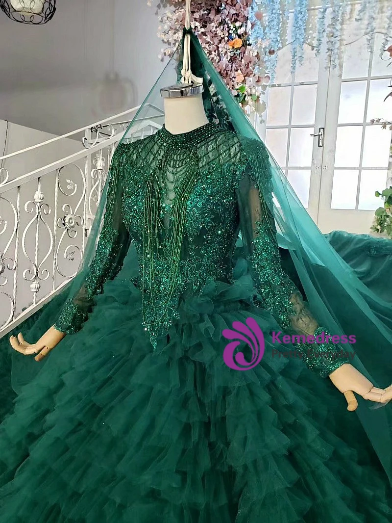 Dark green ball gown wedding dress with beaded tulle bodice, long sleeves and matching embroidered veil